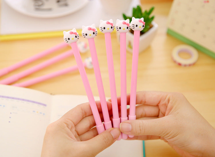 Hand Holding Five Hello Kitty Themed Colored Gel Pen