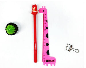 Red Batman Themed Colored Ball Pen Placed Beside Pink Giraffe