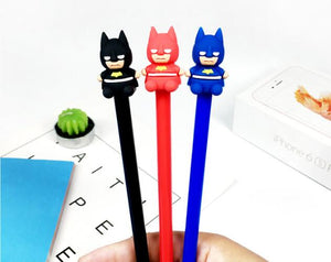 Hand Holding Three Batman Themed Colored Ball Pen